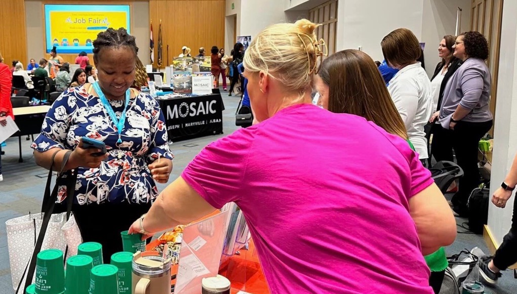 young african american girl interviewing for at the healthcare hiring fair